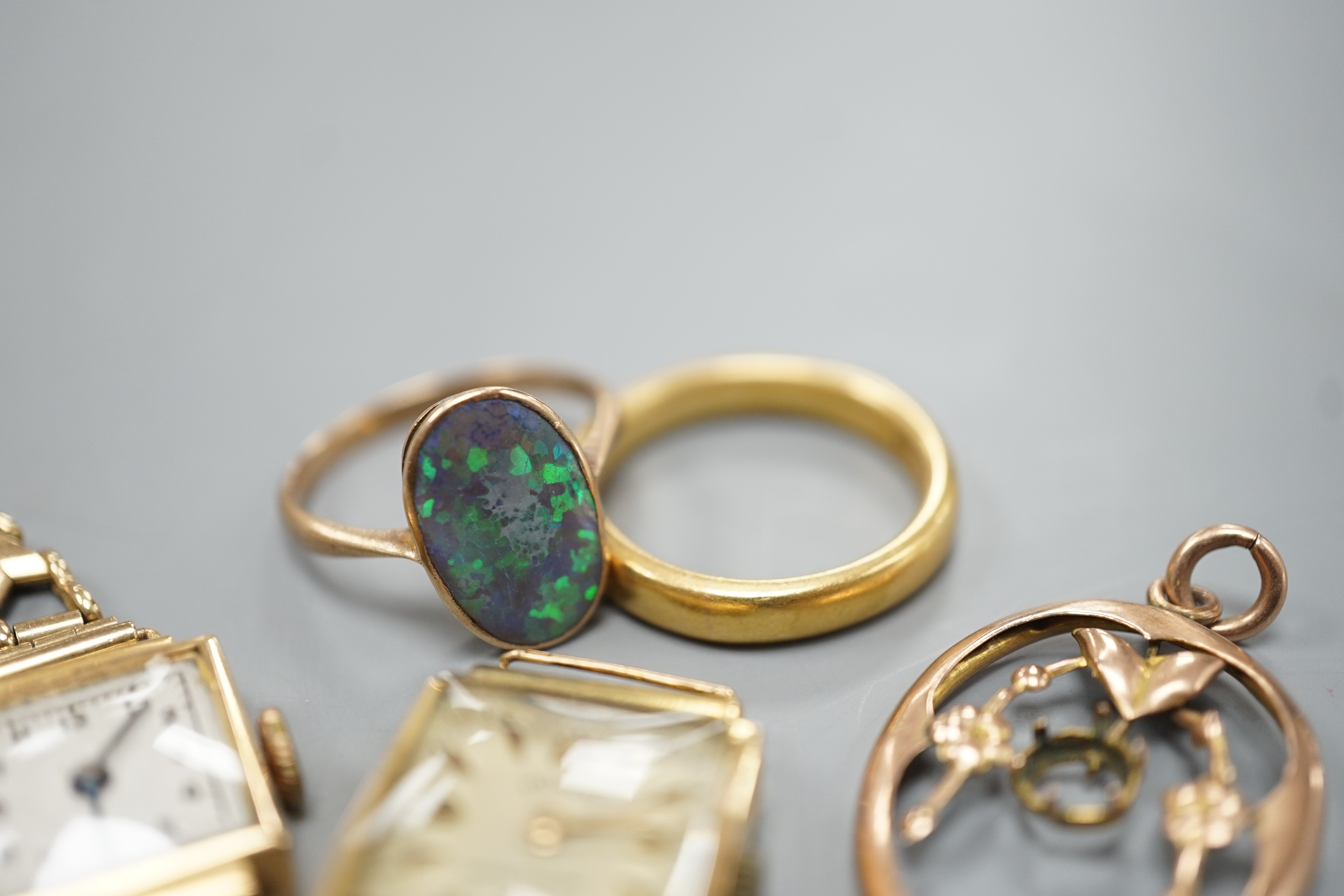A George V 22ct gold wedding band, size P, 7.3 grams, a 9ct and black opal double set oval ring, a yellow metal pendant frame, a lady's 8k cased manual wind Moron wrist watch(no strap) and another lady's 18k cased manual